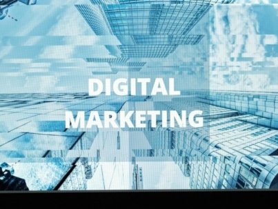 Contemporary office setup featuring digital marketing strategy on a computer screen, ideal for business technology themes.